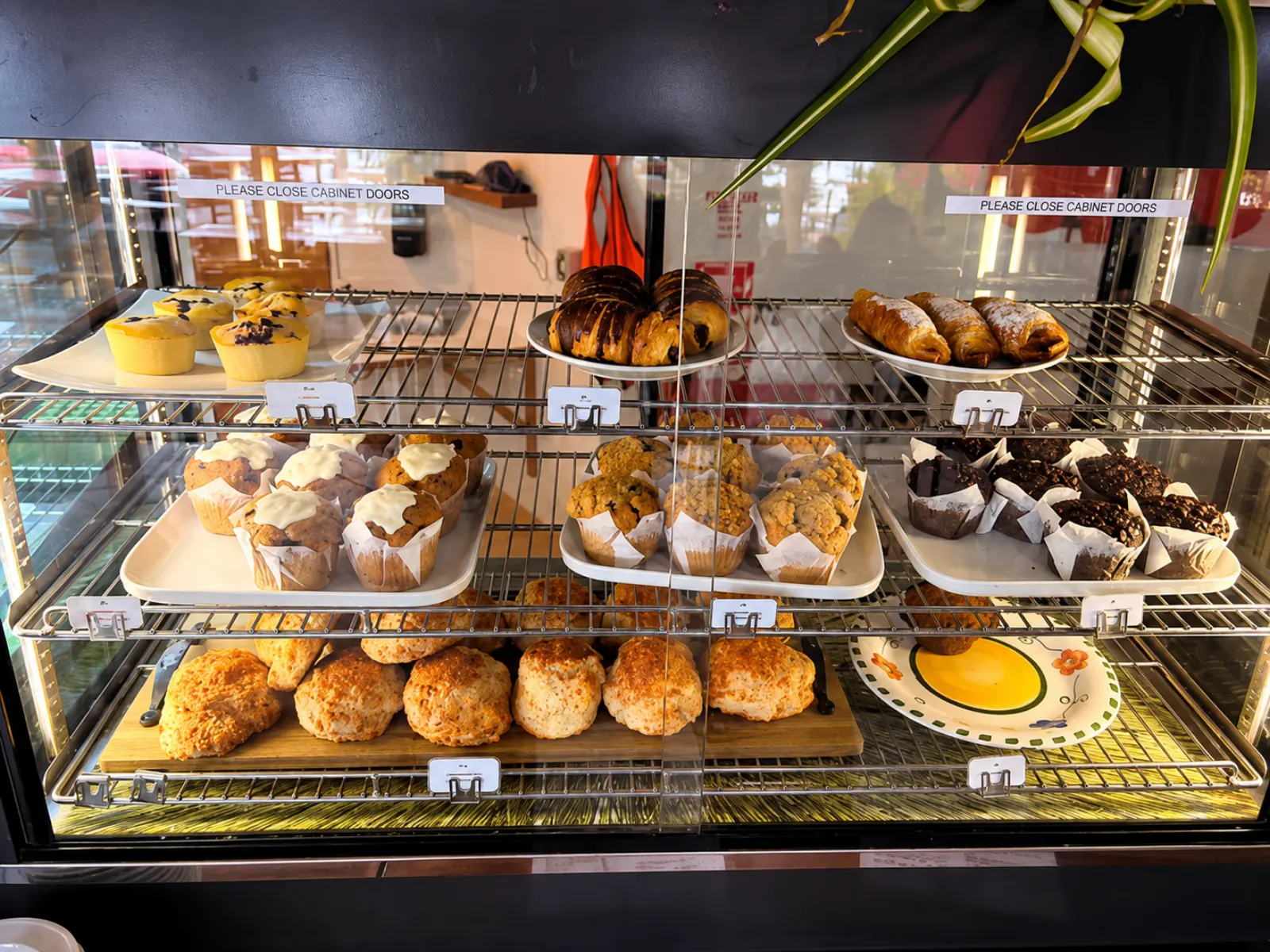 Muffins, scones and pastries fresh in the cabinet