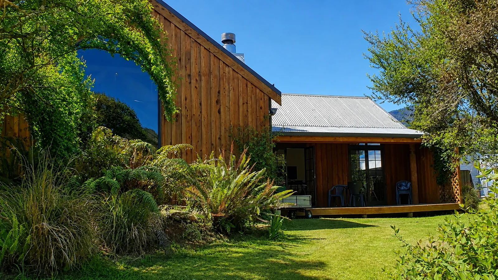 The timber building and garden in the sun